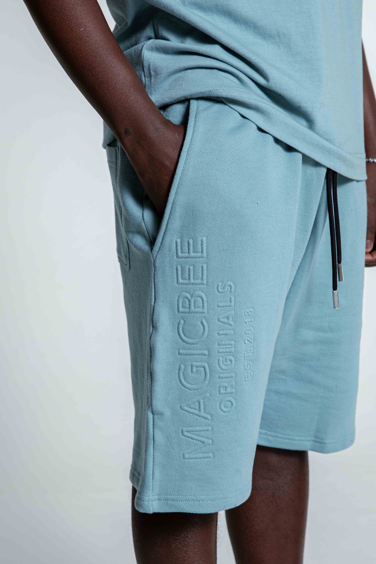 MagicBee Originals Embossed Logo Shorts - Light Blue
